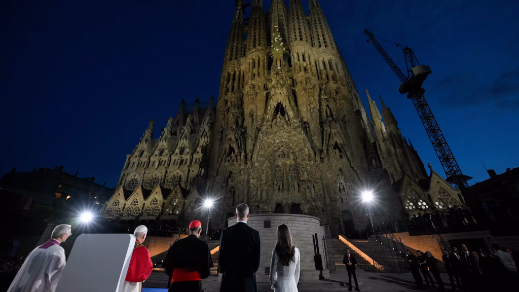 Pope and other officials looking up towards the high spire of Sagrada Familia