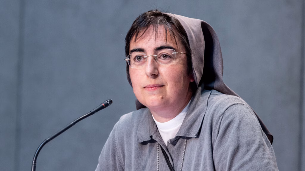Sr Smerilli smiling at a microphone.