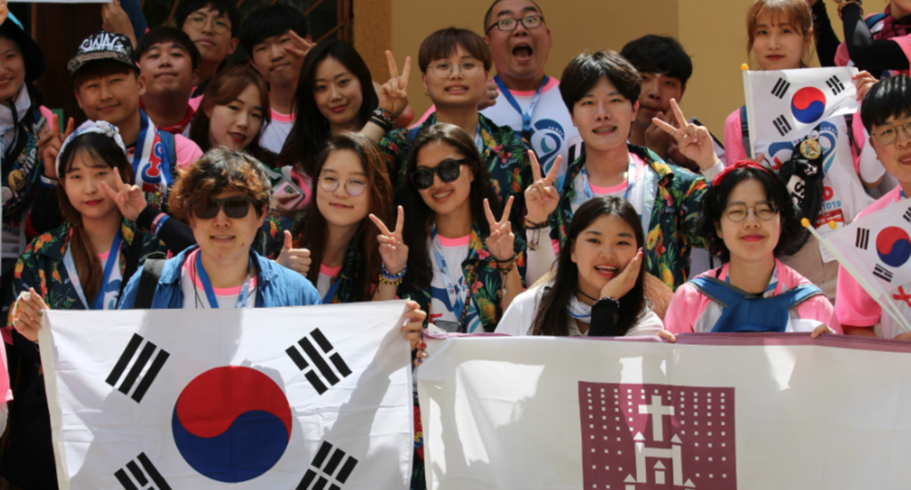 South Korean Catholic pilgrims at World Youth Day holding the South Korean flag